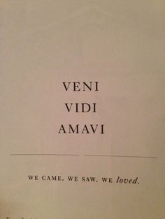 an open book with the words veni vidi amavi written in black on it