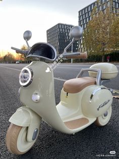 an old scooter is parked on the street