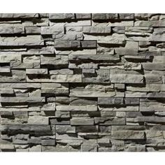 a stone wall that has been made out of grey stones and is very high quality