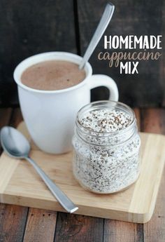 homemade cappuccino mix in a mason jar with spoons on a cutting board