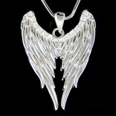 "PERFECT CHRISTMAS GIFT FOR LADIES You are getting a ANGEL WING Pendant inlayed with Swarovski crystals. It comes with a FREE 18\" Original Rhodium Plated Snake Chain necklace with lobster clasp. Pendant size is 1 1/8\" wide X 1 1/2\" high (29mm X 39mm) Crystal Color: Crystal Clear Prices are in US$. For shipping policies and other important information, click on \"profile\" on the right. See an item that you like but has already been sold? Contact me to see if I have more! Thank you for stoppin Prism Necklace, Best Friend Christmas Gift, Best Friend Christmas, Gothic Angel, Necklace Sapphire, Christmas Gift Items, Fairy Pendant, Goth Necklace, Angel Wing Pendant