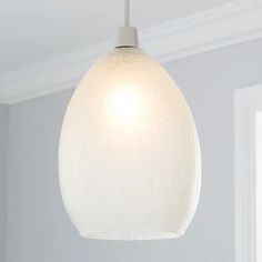 a white light hanging from a ceiling in a room