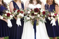 the bride and her bridesmaids are holding their bouquets