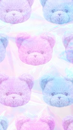 several pastel colored teddy bears on a pink and blue background