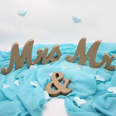 a cake with blue frosting and wooden letters