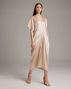 The Kaftan dress features a luminous sand-washed silk that elegantly drapes along the body. The lightweight material and relaxed fit make it easy to slip on and comfortable to wear throughout the day. Perfect for special events or elevated everyday elegance. 100% Sandwashed Silk Made in New York City Product Care: Dry Clean Only Everyday Elegance, Rust Dress, Caftan Dress, Mid Dresses, Kaftan Dress, Ethical Fashion, V Neck Dress, Fashion Company, The Body