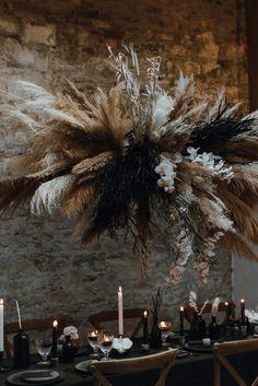 the table is set with black and white decorations