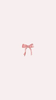 a pink bow on top of a white wall