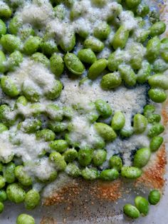 peas and cheese are mixed together in a dish