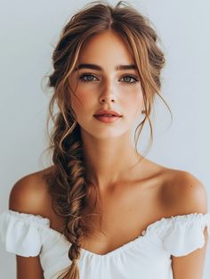 The Boho Fishtail Half-Updo is perfect for outdoor events like music festivals or a casual brunch. This style combines the laid-back vibe of a half-up hairstyle with the intricate detail of a fishtail braid. It’s a versatile look that complements all face shapes and adds a soft, romantic touch. This hairstyle is particularly flattering for those with brown eyes, as it draws attention to the eyes with its relaxed yet polished appearance. Bridesmaid Hair With Fishtail Braid, Half Up Hairstyles With Braid, Fishtail Braid Bridesmaid Hair, Side Braid Bride, Side Braid For Wedding, Chunky Fishtail Braid, Bridesmaids Braided Hairstyles, Bridesmaid Hair Fishtail Braid, Soft Hair Styles