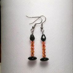 These are all glass bead orange candles with a black flame. These would be perfect for Halloween costumes or all season long! These would make a unique addition to anyone's jewelry collection and make great gifts for friends and family! I can make these in other colors than orange! I can also make these longer or shorter! Flame Earrings, Orange Candle, Black Flame, Halloween Beads, Halloween Orange, Beading Ideas, Party Earrings, Halloween Earrings, Red Earrings