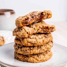 a stack of cookies sitting on top of a white plate