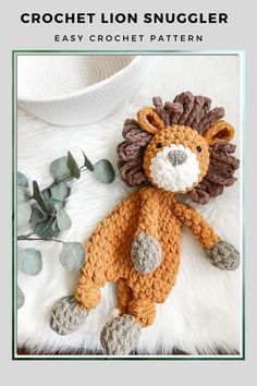 crochet lion snuggler pattern is shown on a white background