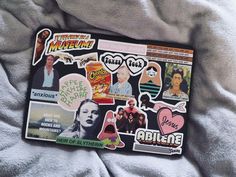 an assortment of stickers on top of a blanket