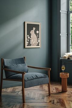 a living room with blue walls and wood flooring is pictured in this image, the chair has an animal print on it