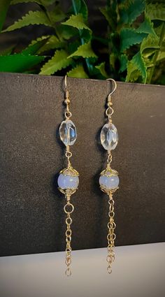 "Elevate your style with these stunning handmade earrings, meticulously crafted from 14k gold-filled wire and adorned with genuine Rock Quartz and natural Blue Chalcedony beads. Delicate and lightweight, they feature a chic gold-filled chain tassel for added flair. The hypoallergenic and tarnish-free 14k gold-filled ear wires ensure both comfort and durability. Measuring approximately 4 inches in length, these earrings make a bold yet elegant statement. If you adore eye-catching accessories, these exquisite earrings are a perfect choice for you. These earrings will arrive in a box ready for gifting.  Feel free to message me with any questions! What is Gold-Filled? Gold-filled pieces are second to pure gold as the gold has been mechanically bonded to the base metal (brass, copper, etc..). G Boho Drop Earrings, Earrings Luxury, Jewelry Birthday, Birthday Jewelry Gift, Bohemian Earrings, Blue Chalcedony, Pure Gold, Gold Filled Jewelry, Gold Filled Chain