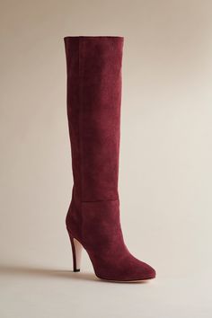 A to-the-knee, show-stopping boot In Oxblood suede. Heel height: 3” / 76.2 mm Luxury Suede Knee-high Boots, Luxury Suede Knee-high Heeled Boots, Luxury Suede Knee-high Boots With Pointed Toe, Luxury Formal Suede Knee-high Boots, Luxury Suede Knee-high Boots For Formal Events, Luxury Suede Knee-high Boots For Formal Occasions, Fitted Knee-high Suede Boots With Suede Lining, Fitted Suede Knee-high Boots With Suede Lining, Elegant Knee-high Suede Boots