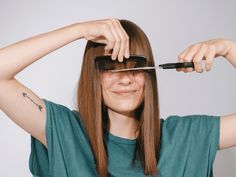 Want to learn how to trim or cut your own bangs without ruining your haircut? Here, a hairstylist shares a step-by-step breakdown of how to cut bangs at home. Trim Bangs, Trim Your Own Hair, How To Cut Your Own Hair, How To Cut Bangs, Stimulate Hair Follicles, Hair Growth Supplement, Hair Care Brands, Professional Hairstylist, Celebrity Hair Stylist