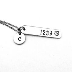 This hand stamped necklace makes a great gift for a Police Officer's girlfriend, wife or mom. This is also perfect for a anniversary or Valentine's Day present. The badge number and a police shield will be hand stamped on a 3/8 x 1 1/2" aluminum bar charm and includes an initial charm, a stainless steel lobster clasp and stainless steel cable chain.  *Please note that due to the nature of hand stamping we don't stamp on the back of our items. Thanks so much! Each letter has been individually han Hand Stamped Dog Tag Jewelry For Anniversary, Mother's Day Hand Stamped Dog Tag Jewelry, Stamped Dog Tag Jewelry For Gift, Hand Stamped Dog Tag Jewelry As Gift, Hand-stamped Dog Tag Jewelry Gift, Engraved Dog Tag Jewelry For Birthday, Hand Stamped Nameplate Jewelry For Anniversary, Hand Stamped Nameplate Jewelry For Anniversary Gift, Anniversary Stainless Steel Necklace