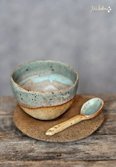 a bowl and spoon sitting on top of a wooden table next to an instagram page