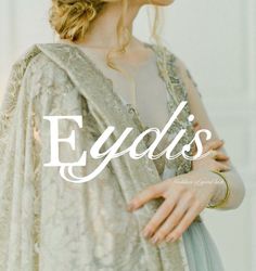 a woman wearing a white dress with the words eydlis on it