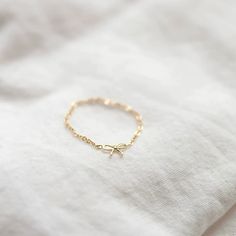 This 14k gold chain ring features a delicate bow, making it ideal for everyday wear. Its petite design is perfect for making a subtle statement. #bow #coquette Gold Chain Ring, Bow Coquette, Ring Tutorial, Bow Making, Diamond Free, Pink Outfit, Chain Ring, Dainty Jewelry, Stacking Rings