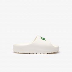 Wider and more rugged, the Serve Slide 2.0 is made for relaxation. The padding in the sole offers extra cushioning and support. For exceptional comfort, every day. Tennis Whites, Swim Gifts, Lacoste Women, Swim Shoes, Slides Women, Summer Sunglasses, White Polo, Slides Shoes, 2024 Collection