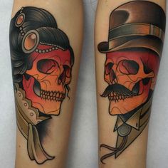 two skulls with hats and mustaches on their legs