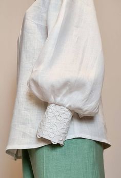 "Linen Blouse of a semi-adjacent silhouette.   - Back with middle seam - Puff sleeves  - Wide cuff, fastened with 2 buttons - The neck is finished with a stand-up collar - Optionally, the model can be decorated with white or black lace on the left half of the front and on the cuffs. SIZE CHART: SIZE XS (mostly USA/CA-2, UK-4, AU/NZ-6, JAP-5, EU-32) Bust/Waist/Hips 80cm/60cm/88cm 31.5\"/25.2\"/34.5\" SIZE XS/S (mostly USA/CA-4, UK-6, AU/NZ-8, JAP-7, EU-34) Bust/Waist/Hips 84cm/64 cm/92cm 33\"/26.5\"/36.2\" SIZE S (mostly USA/CA-6, UK-8, AU/NZ-10, JAP-9, EU-36) Bust/Waist/Hips 88cm/68cm/96cm 34.5\"/28.5\"/37.7\" SIZE M (mostly USA/CA-8, UK-10, AU/NZ-12, JAP-11, EU-38) Bust/Waist/Hips 92cm/72cm/100cm 36.2\"/30\"/39.5\" SIZE L (mostly USA/CA-10, UK-12, AU/NZ-14, JAP-13, EU-40) Bust/Waist/Hips Casual Lace Blouse With Lace Cuffs, Bohemian Puff Sleeve Billowy Tops, Billowy Puff Sleeve Bohemian Top, Bohemian Billowy Puff Sleeve Top, Casual Fitted Blouse With Lace Sleeves, Summer Puff Sleeve Top With Billowy Bishop Sleeves, Fall Blouse With Lace Puff Sleeves, Feminine White Blouse With Lantern Sleeves, Summer Billowy Puff Sleeve Top With Bishop Sleeves