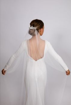 the back of a woman wearing a wedding veil