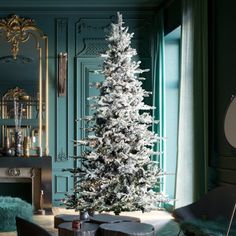 a white christmas tree in a living room