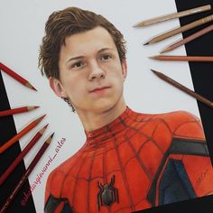 a drawing of spider - man surrounded by colored pencils