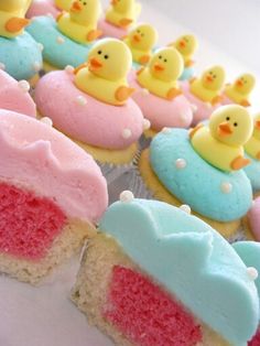 cupcakes with frosting and rubber ducks on them