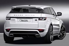 the rear end of a white range rover