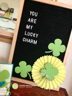 there is a sign that says you are my lucky charm next to some cards and flowers