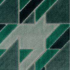 a green and black rug with an abstract design on the bottom corner, in shades of grey