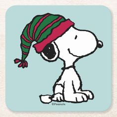 a cartoon snoopy dog wearing a green and red hat beverage coasters, set of 4