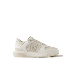 AMIRI upgrades traditional court sneakers with its signature iconography in this 'Classic Low' pair. Detailed with a staggered logo and signature star perforations, they have leather uppers, suede trims and stacked, two-tone rubber soles. Wear them with the label's jeans or track pants. Luxury Sneakers With Embossed Logo For Streetwear, Classic High-top Custom Sneakers With Embossed Logo, Luxury High-top Sneakers With Embossed Logo, Luxury High-top Sneakers With Embroidered Logo, Luxury Sneakers With Perforated Toe Box For Streetwear, Luxury High-top Sneakers With Perforated Toe Box, Luxury Custom White Sneakers With Embossed Logo, Luxury White Custom Sneakers With Embossed Logo, Luxury Low-top Sneakers With Perforations