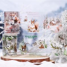 an image of christmas cards with animals in the snow and trees behind them on display