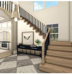 a staircase leading up to a kitchen and living room in an open floor plan with white walls