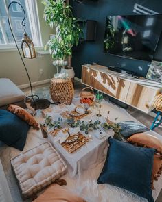 a living room filled with lots of furniture and decor on top of a white table