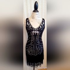 Beautiful Silver And Black Vintage Flapper Dress By Babeyond, Brand New W/Tags, Sleeveless, V-Neck, Sequined, Beaded, Black Fringe, Size S, Side Zipper, Black Base Layer, 100% Polyester. Black V-neck Flapper Dress For Party, Black V-neck Flapper Dress For Evening, Fitted V-neck Flapper Dress, V-neck Flapper Dress For Party Season, Elegant V-neck Flapper Dress For Night Out, Fitted V-neck Flapper Dress For Night Out, Black Sleeveless Flapper Dress For Cocktail, Black Sleeveless Flapper Dress For Summer, Black Flapper Dress