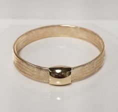 Thanks for shopping our vintage estate store. We tend to sell well below wholesale and truly hope you enjoy all of our items. Many of the items are one of a kind, so please enjoy scrolling through the pictures and hopefully something will catch your eye. Black spots are from reflections or camera. Beautiful estate 14k yellow gold stretch mesh bangle cuff diamond cut design. Stunning bracelet. Smaller than most, stretches to 8" or more, but stretches back to 7.5".   Size: 2" stretches to 3" Width: 8mm 3/8" Diam: 7.5"  Thickness: 2.5mm Weight: 3.0 grams Marked 14k, one that you will love. Bracelet Bangle, Black Spot, Eye Black, Cut Design, Diamond Cut, Bangle Bracelets, Diamond Cuts, Jewelry Rings, Size 2