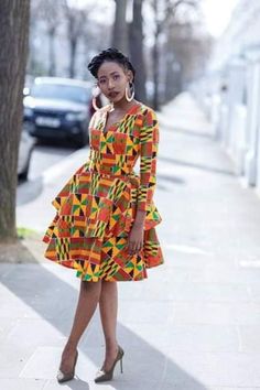 Kente midi dress is made from kente fabric . It is long sleeve skate dress made with zip at the back to fit. Ankara dress is a type of dress that is made from Ankara fabric, which is a colorful cotton fabric with various patterns and designs. Ankara fabric is also known as African wax print, Dutch wax, or African print1. Ankara dress is popular among African women, especially in Nigeria, Ghana, and other West African countries. Ankara dress can be worn for different occasions, such as weddings, parties, casual outings, and cultural events. Ankara dress can be styled in various ways, such as short dresses, long dresses, maxi dresses, midi dresses, skater dresses, kimono dresses, and more. Ankara dress can also be accessorized with headwraps, belts, jewelry, and shoes to create a unique and Nigerian Designers, Nigeria House, African Print Designs, Nigeria Women, Nigerian Dress Styles, Nigerian Ankara, Kenya Fashion, Extraordinary Fashion, Kitenge Fashion