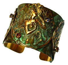 PRICES MAY VARY. Patina Brass Art Nouveau Lady with Flowers Cuff Bracelet - Authentic Crystals 2 inch wide Cuff Style Bracelet Patina Brass Art Nouveau Lady with Flowers Cuff Bracelet with Copper and Tanzanite Authentic Crystals One Size Fits All, easily shaped to fit the wrist Patina Brass Art Nouveau Lady with Flowers Cuff Bracelet includes Artist's Bio and Designer Velvet Pouch with Trademark Tag One of a kind patina on solid brass. A Beautiful Art Nouveau Cuff Style Bracelet with a flowing F Lady With Flowers, Art Nouveau Lady, Earthy Jewelry, Brass Art, Turtle Pendant, Jewelry Lookbook, Wide Cuff, Hinged Bangle, Dream Jewelry