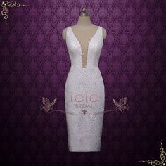 a white dress on a mannequin with butterflies around it and the words ieie bridal