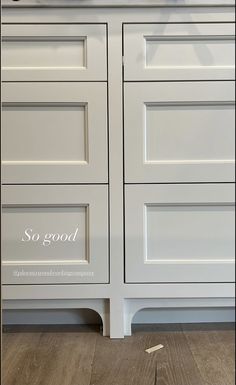 an image of a white cabinet with some writing on the front and bottom drawers that say so good