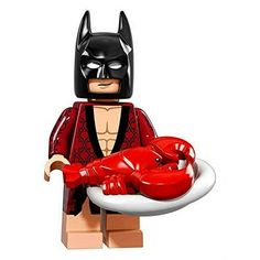 the lego batman movie character is holding a lobster