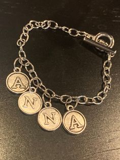 This bracelet is super cute and can be made for most names!  Please include the name you would like on the bracelet in a note at purchase. Cell Phone Charms, Perfect Stocking Stuffers, Name Bracelet, Phone Charm, Cute Earrings, Charm Bracelets, Book Gifts, Custom Name, Stocking Stuffers