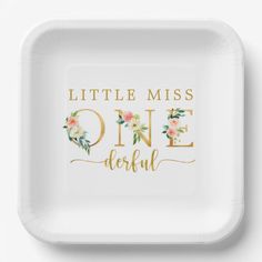 a little miss onederful paper plate with gold lettering and flowers on the front